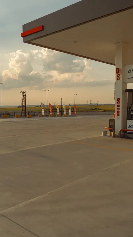 Gas station forecourt at golden hour